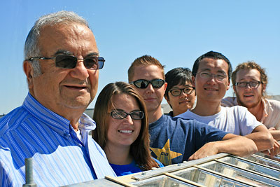 Roland Winston, left, and team of student researchers that designed XCPC system.